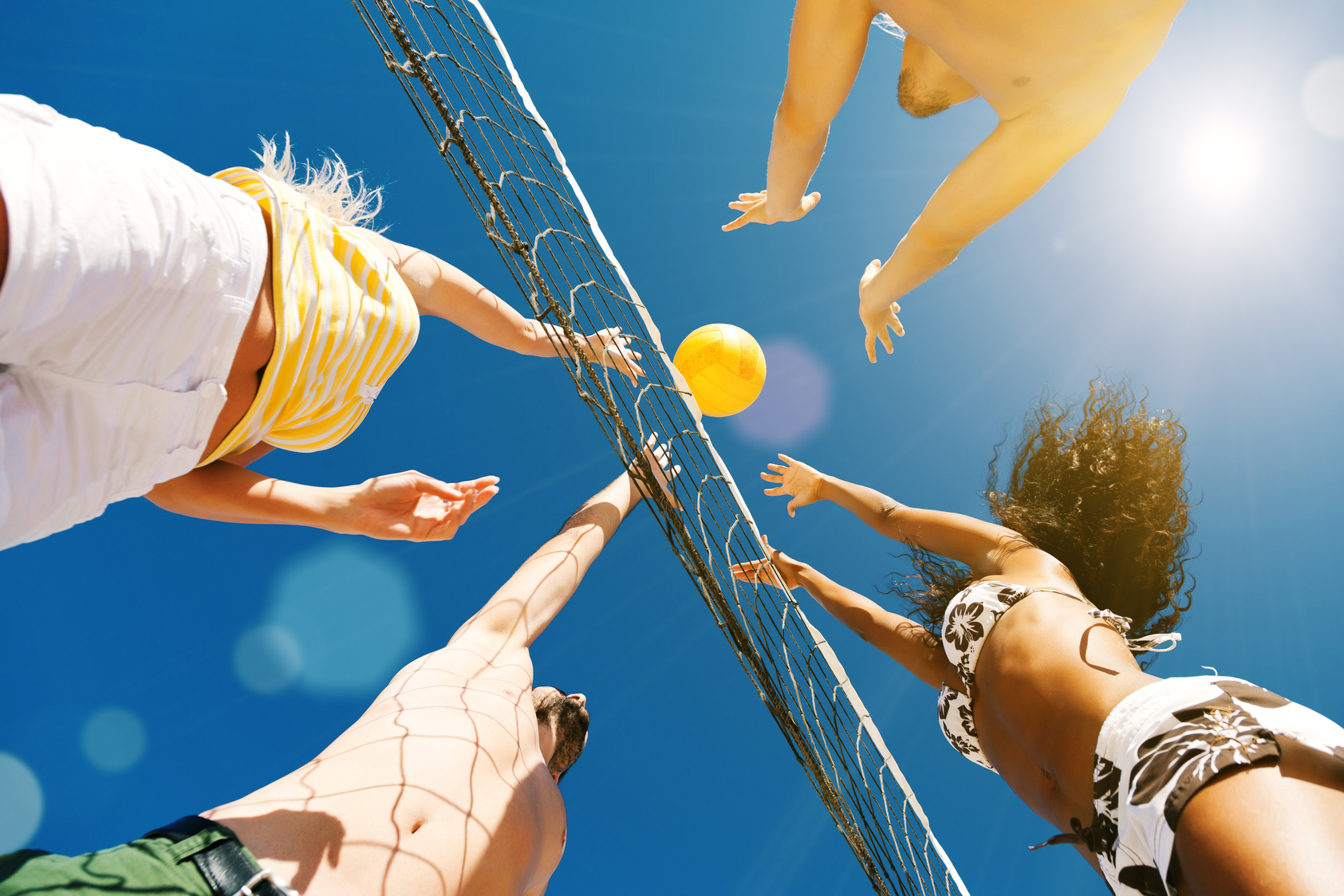 Friends Playing Beach Volleyball