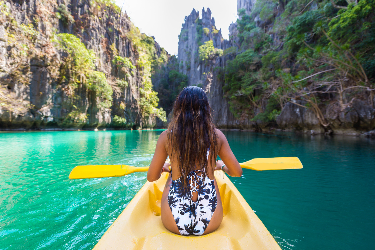 Woman Kayaking in Big lagoon, Palawan